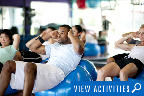 diverse group in fitness class, click to register for fitness