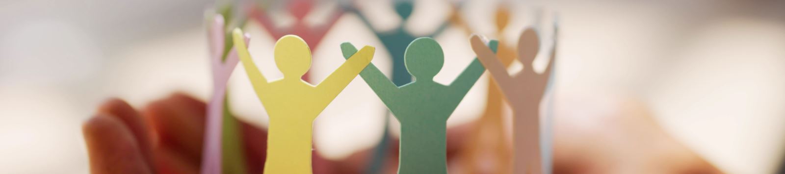 paper cutout of people in partnership